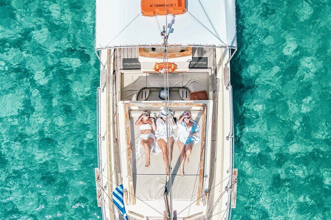 6 Hour Private Cruise in Mykonos with Food and Drinks - Meet Grigoris and the Traditional Boat Feel
