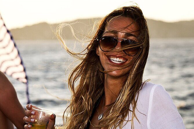 Boat Party with Swimming Stop Experience in Mykonos - Sunset and coastline lights: why the timing feels special