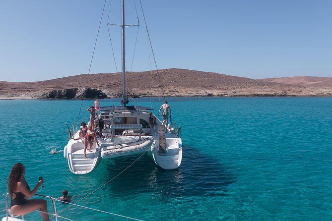 Catamaran Day & Sunset Cruises with meals Drinks and transportation - The sailing route: Mykonos south coast, Delos photos, then Rhenia