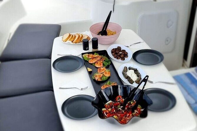 Morning and Sunset Cruise with Meal and Transport Included - Lunch on deck: fresh meal, sea view, and the practical comfort of not cooking