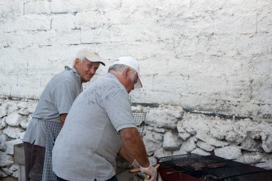 Mykonos: Barbecue at a Mykonian Farm - Welcome treats, stone couch seating, and raki to start the story