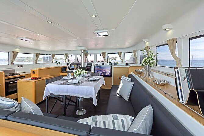 Mykonos Catamaran Premium Day-Sunset Tours 8-flavor Meal & Drinks - Delos From the Water: A Quick UNESCO Moment (Only in Calm Seas)