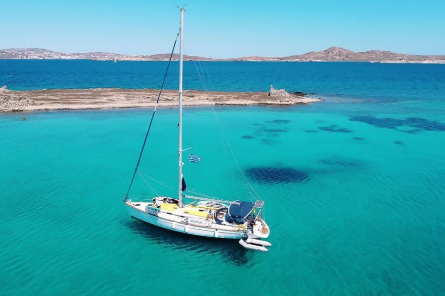 Mykonos: Delos and Rhenia Cruise with Swim and Greek Meal - Lunch, wine, and the onboard Greek meal pacing