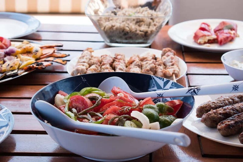 Mykonos: Delos and Rhenia Islands Cruise with BBQ Meal - The morning rhythm: Agios Ioannis area and scenic cruising