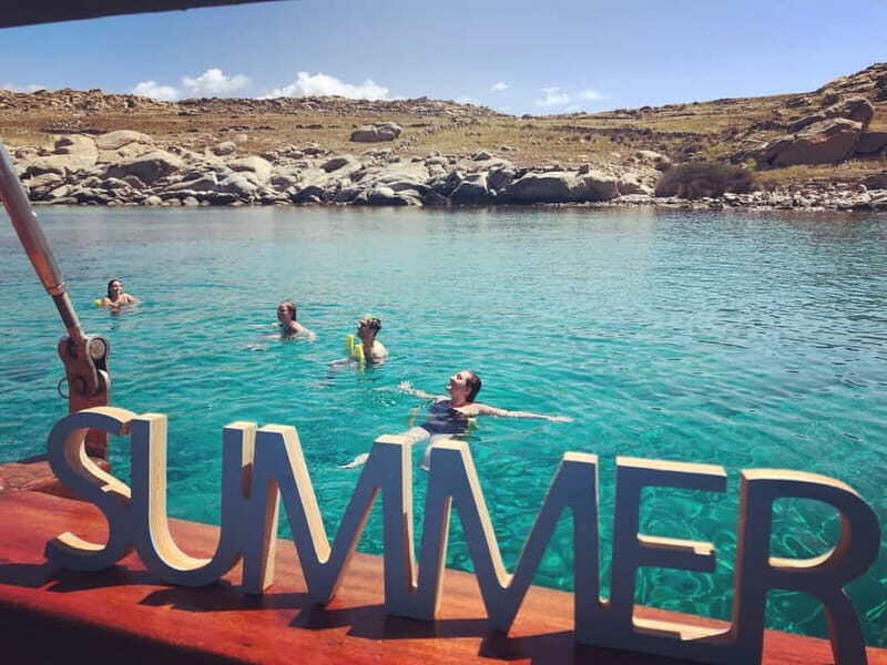 Mykonos: Delos and Rhenia Islands Cruise with BBQ Meal - Rhenia Island: the swim-and-BBQ payoff