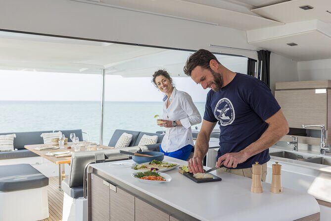 Mykonos: Luxury Catamaran Cruise with Meal, Drinks & Transport - The Rhenia stop: swimming, snorkeling, and using the water toys without stress