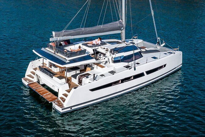 Mykonos: Luxury Catamaran Cruise with Meal, Drinks & Transport - Getting to the meeting point: Agia Anna and the tender-boat moment