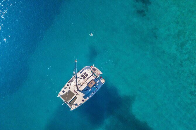 Mykonos: Private Catamaran Cruise—Hotel Pickup, BBQ & Drinks - Delos in One Hour: Ancient Ruins Without the Marathon