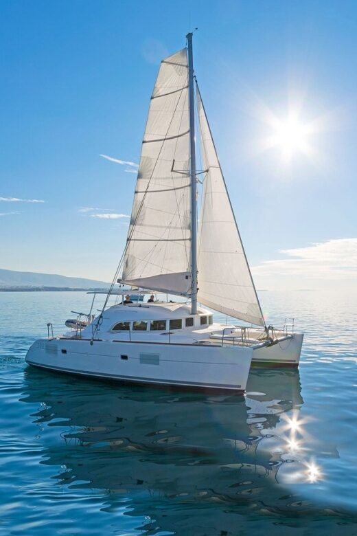 Mykonos: Private Catamaran Cruise w/ Food, Drinks & Transfer - Delos Photo Stop From the Water: Quick Look, Real Context
