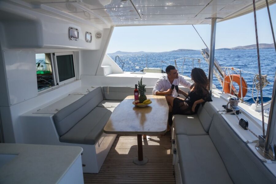 Mykonos: Private Catamaran Cruise w/ Food, Drinks & Transfer - Sailing Back Past Mykonos: Windmills, Aperitif Moments, Optional Sunset