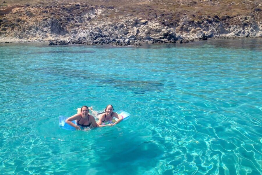 Mykonos: Yacht Cruise to Rhenia and Guided Tour of Delos - Getting On the Yacht: Safety Briefing, Sails, and the Mood on Board